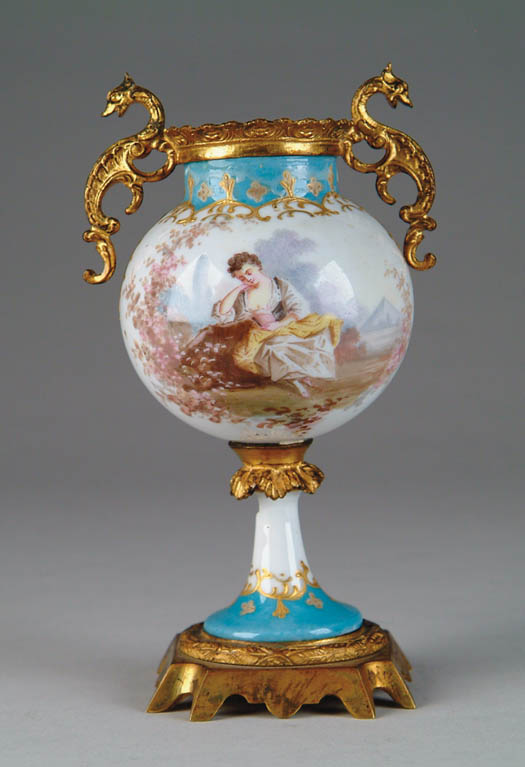 Appraisal: PORCELAIN SEVRES ORMOLU DECORATED SMALL VASE The bulbous center body