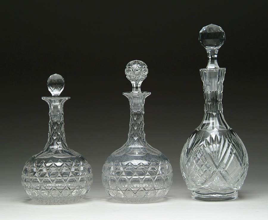 Appraisal: THREE CUT GLASS DECANTERS Lot of three decanters consists of