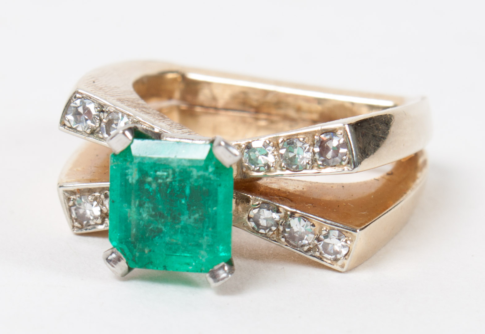 Appraisal: Emerald diamond and florentine gold ring unmarked yellow white gold