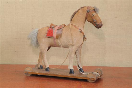 Appraisal: HORSE PULL TOY Mohair covered wooden horse with horse hair