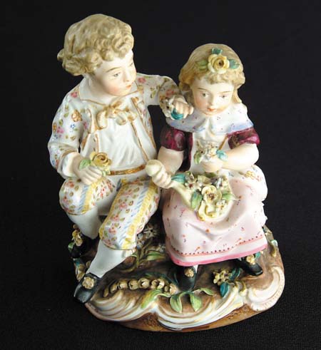 Appraisal: MEISSEN FIGURINE OF GIRL AND BOY Blue cross sword marks