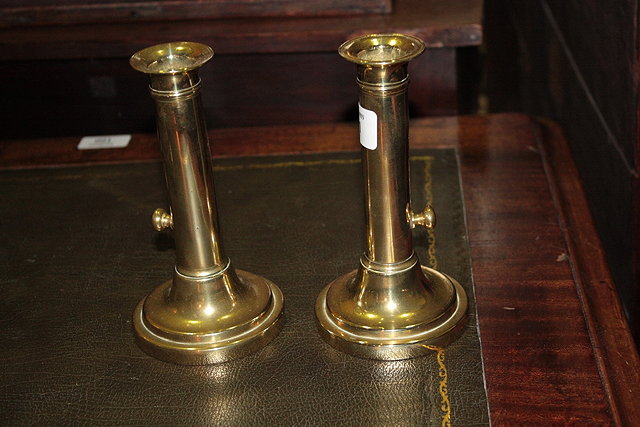 Appraisal: A PAIR OF BRASS SHORT STEM CANDLESTICKS with circular bases