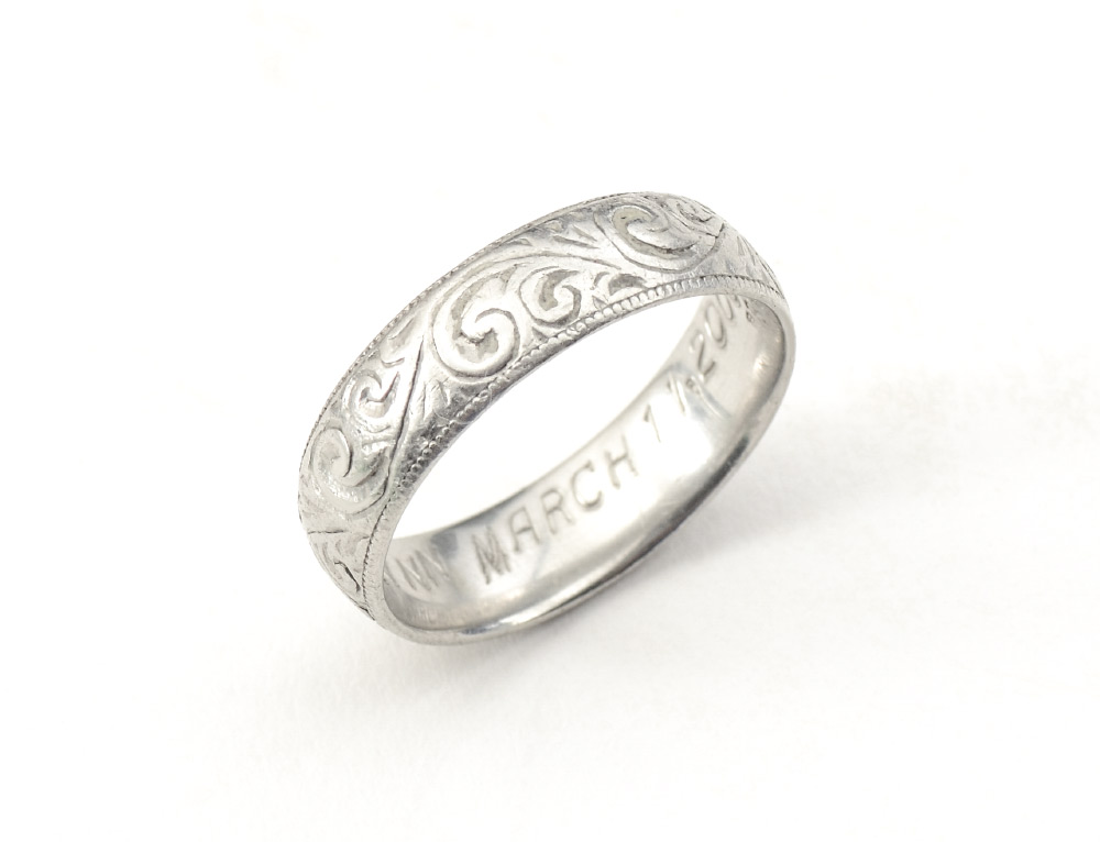 Appraisal: PLATINUM WEDDING BAND FROM BROWN NEWIRTH Hand engraved by iconic