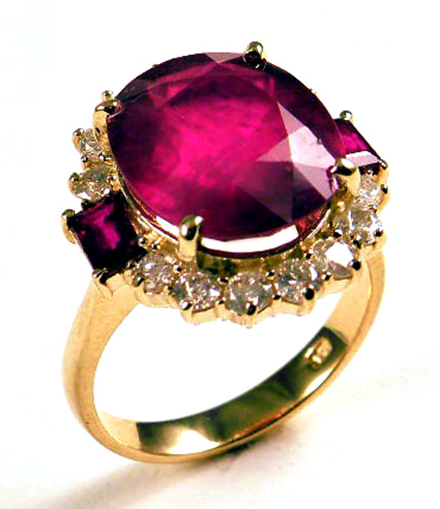 Appraisal: RUBY DIAMOND AND FOURTEEN KARAT GOLD RING centering an oval