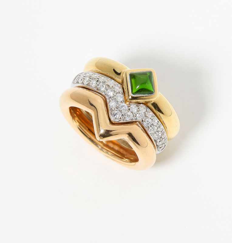 Appraisal: An K tri-color gold three band ring with a sugar-loaf