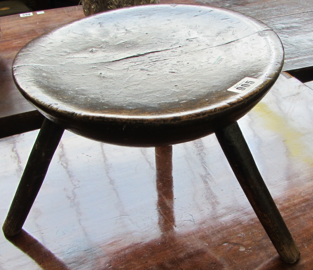 Appraisal: A small th century stool the circular oak top on