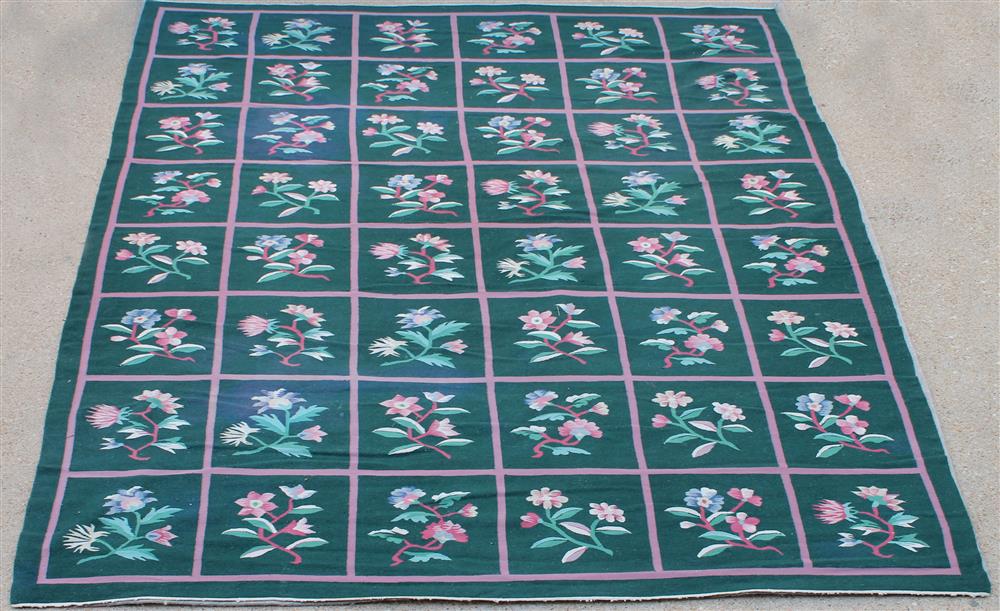 Appraisal: INDIAN DHURRIE WOOL FLORAL RUG green field with pink and