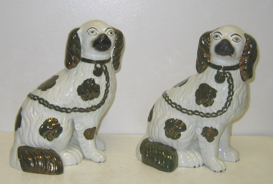 Appraisal: PAIR STAFFORDSHIRE DOGS Both seated spaniels with copper luster enhanced