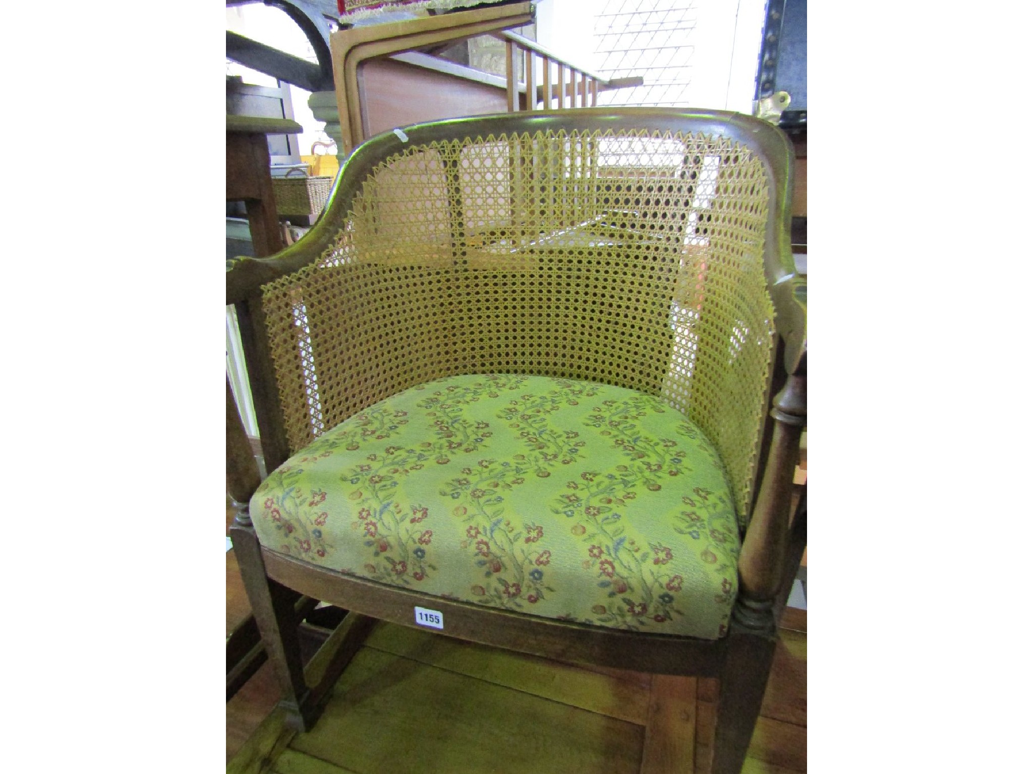 Appraisal: An Edwardian walnut tub chair the horseshoe shaped and cane