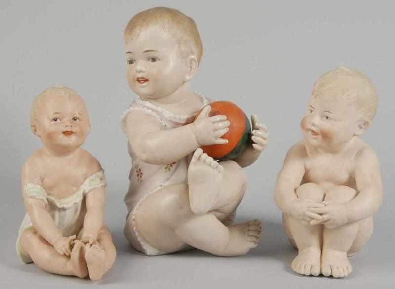 Appraisal: Lot of German Bisque Piano Baby Figurines Description Gebr Heubach