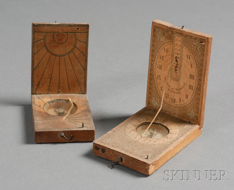 Appraisal: Two German Fruitwood Pocket Sundials the first with printed paper