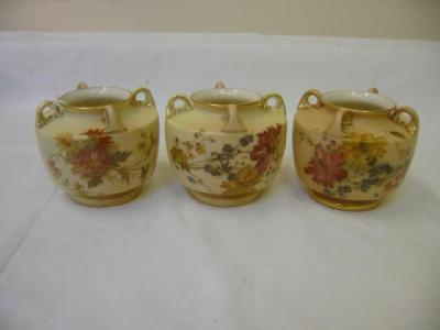 Appraisal: THREE ROYAL WORCESTER BLUSH PORCELAIN VASES of squat circular form