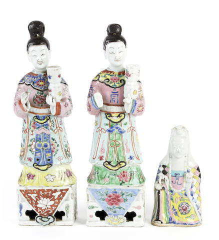 Appraisal: Three famille rose figures Comprising two standing figures wearing colourful