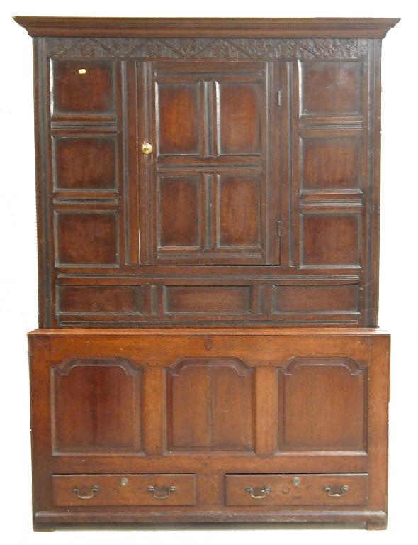 Appraisal: Antique oak press the moulded cornice over a panelled cupboard