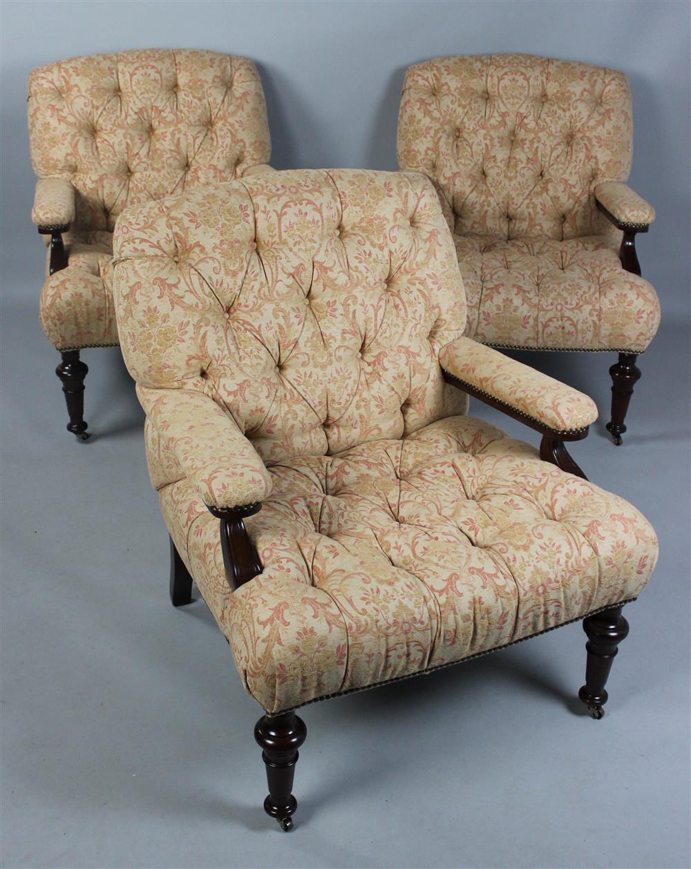 Appraisal: SET OF THREE ENGLISH STYLE OVERUPHOLSTERED AND TUFTED LIBRARY CHAIRS