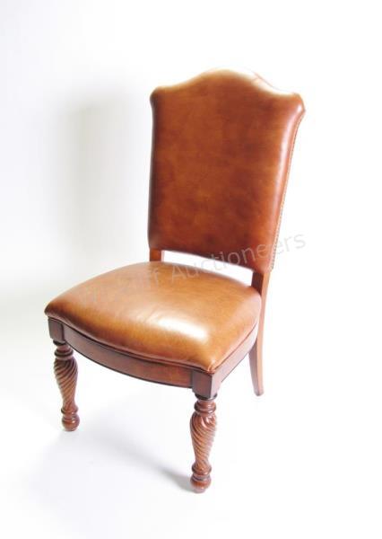 Appraisal: A leather office guest chair with carved legs and nailhead