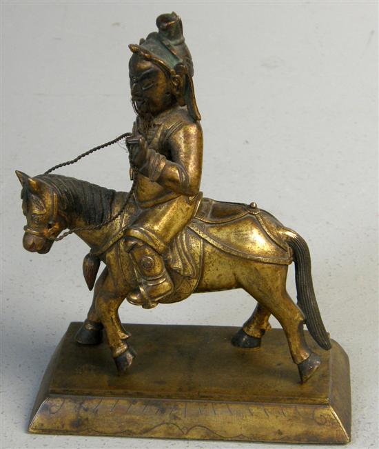 Appraisal: Eastern gilt metal figure of a man on a horse