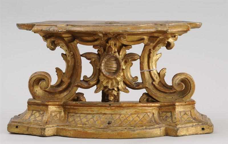 Appraisal: ITALIAN BAROQUE CARVED GILTWOOD STAND The shaped top above pierced