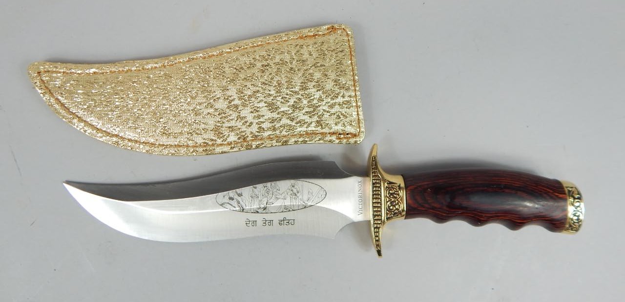 Appraisal: A reproduction Eastern style dagger the curved blade stamped Victorinox