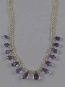 Appraisal: A pearl and faceted amethyst necklace approx cm long with