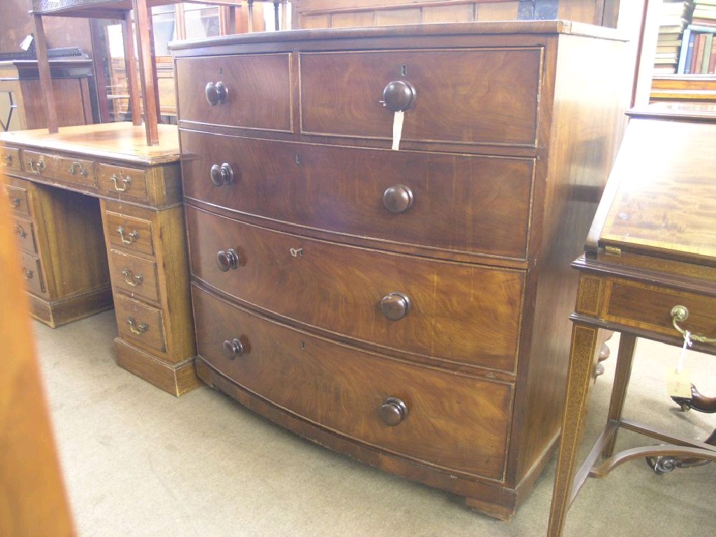 Appraisal: An early Victorian bow fronted mahogany chest two short and