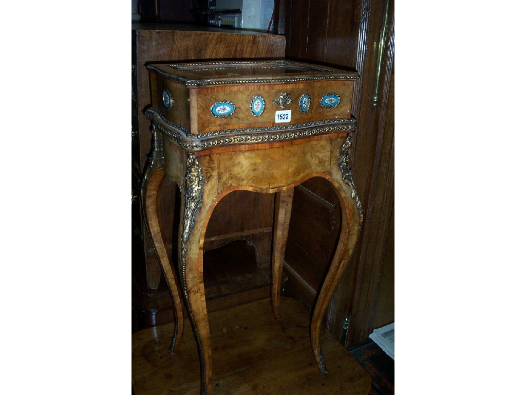 Appraisal: A small Victorian figured walnut vitrine with rising lid raised