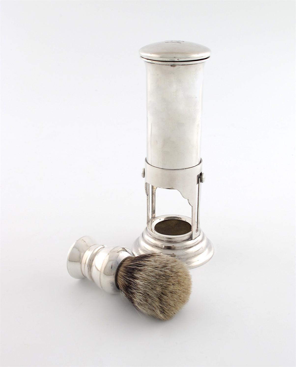 Appraisal: An Edwardian silver shaving brush stand shaving water heater