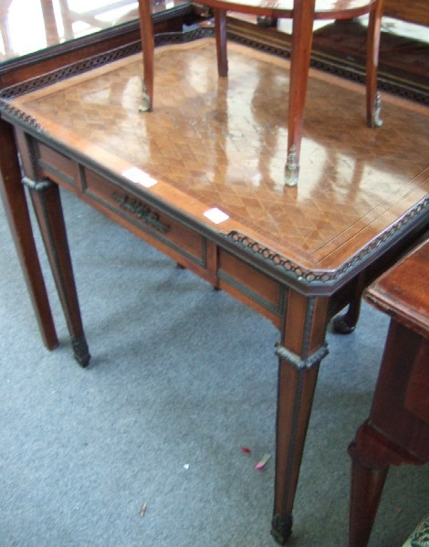 Appraisal: A th century French side table the pierced three quarter