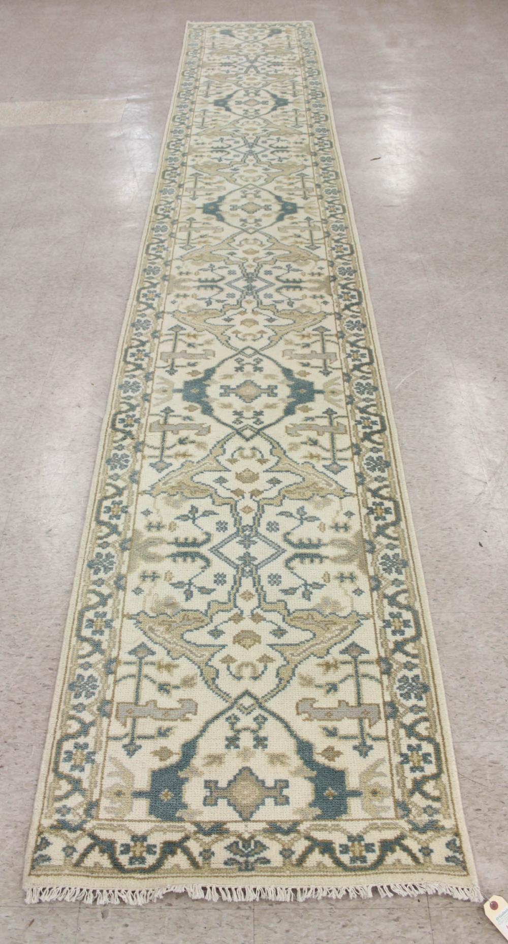 Appraisal: HAND KNOTTED ORIENTAL RUNNER Indo-Persian stylized floral design on cream