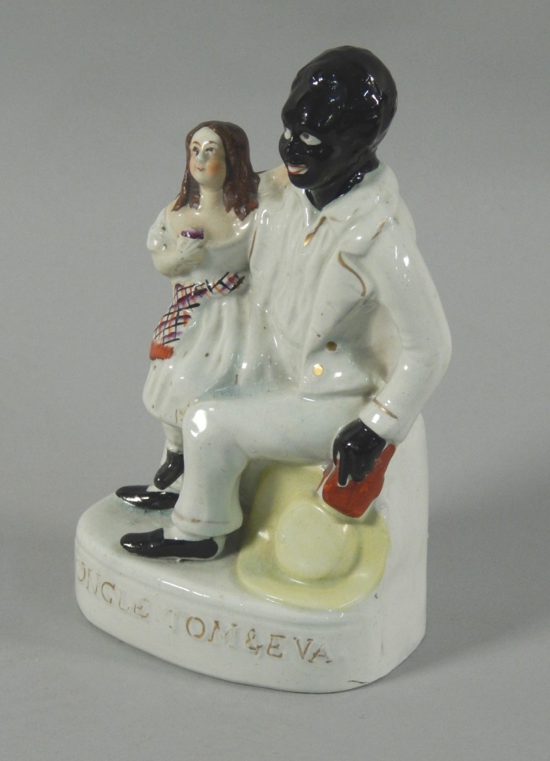 Appraisal: A mid thC Staffordshire figure of Uncle Tom Eva picked