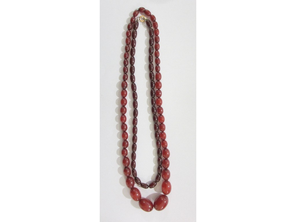 Appraisal: Two strings of cherry amber beads