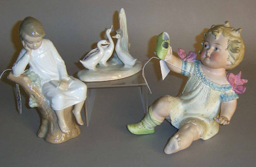 Appraisal: Lladro figure of a child h together with a bisque