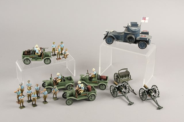 Appraisal: Lot of metal vehicles artillery pieces one limber and one