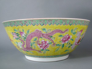 Appraisal: Large Chinese famille rose yellow ground punch bowl enamelled with