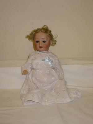 Appraisal: A Gebruder Ohlhaver bisque head character doll with brown glass