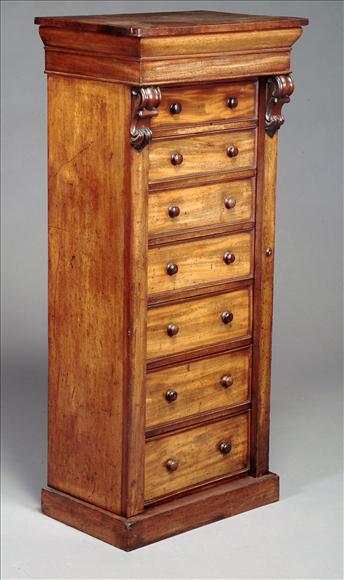 Appraisal: A Victorian mahogany Wellington chest circa of seven drawers on