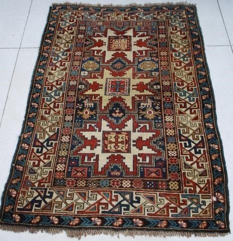 Appraisal: LATE TH CENTURY CAUCASIAN SCATTER RUG GEOMETRIC DESIGN TWO HOLES