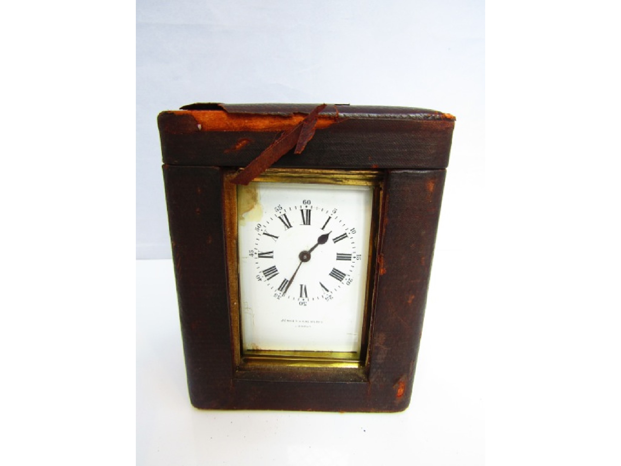 Appraisal: A brass carriage clock with enamel dial and day time