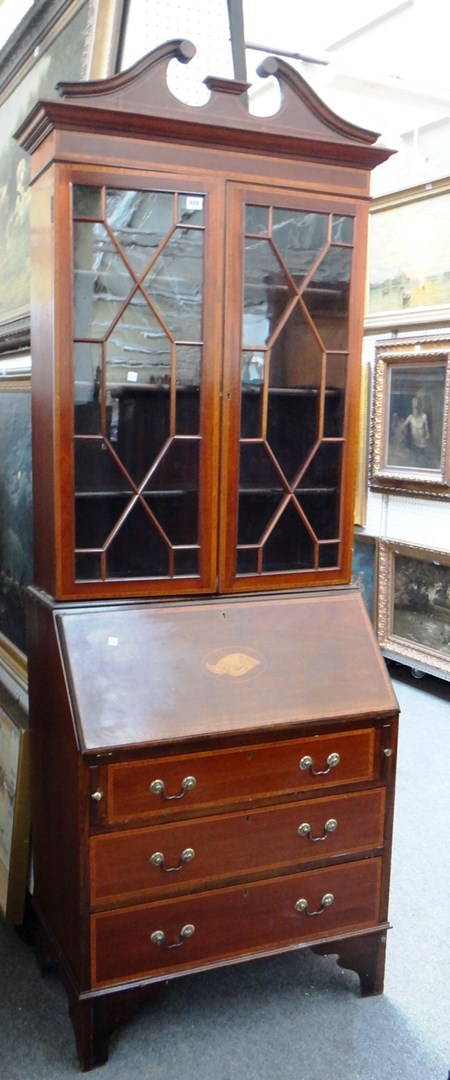 Appraisal: An Edwardian softwood banded mahogany bureau bookcase on bracket feet