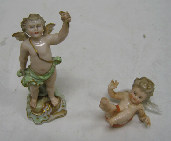 Appraisal: TWO MEISSEN STYLE PUTTI One laying on his back bearing