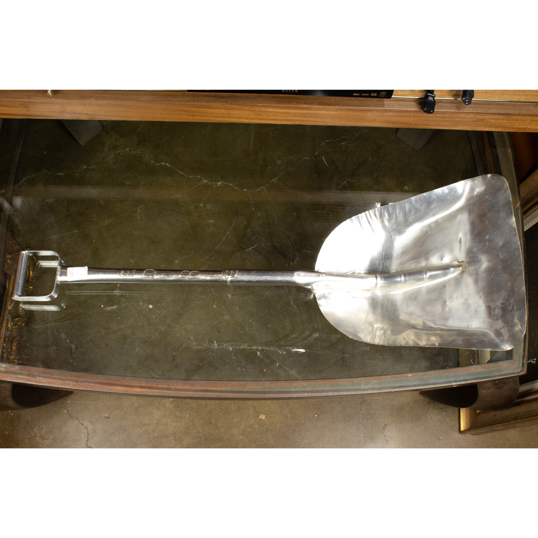 Appraisal: ALUMINUM SCULPTURE OF A SHOVEL INSCRIBED 'EDIBLE' Aluminum sculpture of