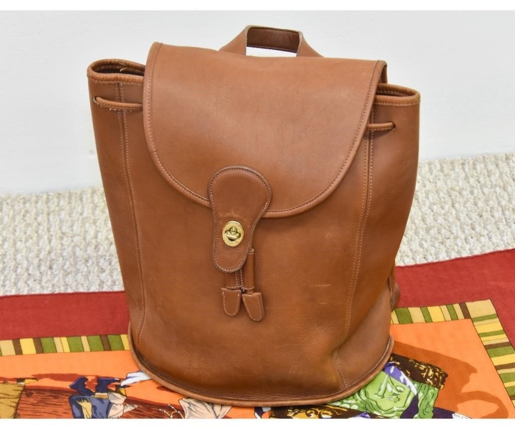 Appraisal: Light brown Coach leather backpack together with a large cashmere