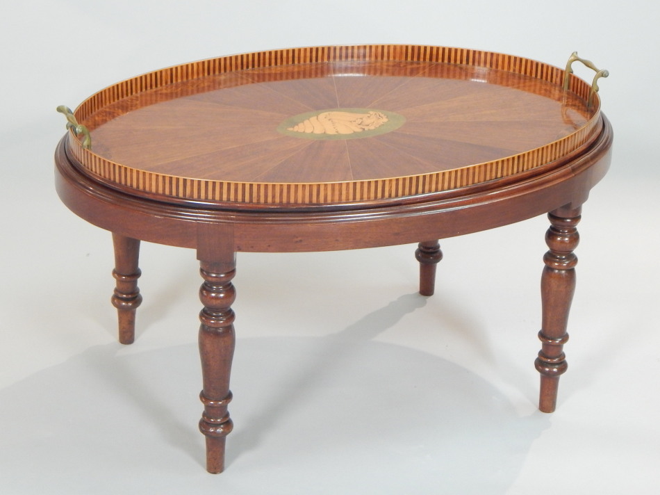 Appraisal: A late thC Sheraton Revival oval mahogany and amboyna tea