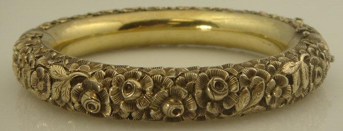 Appraisal: Sterling and K YG floral repousse bangle bracelet marked ORO