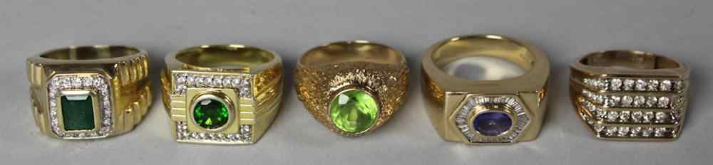 Appraisal: GROUP OF FIVE RINGS including gilt-silver ring with a central