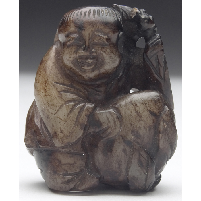 Appraisal: Chinese sculpture early Chine period seated figure in brown jade