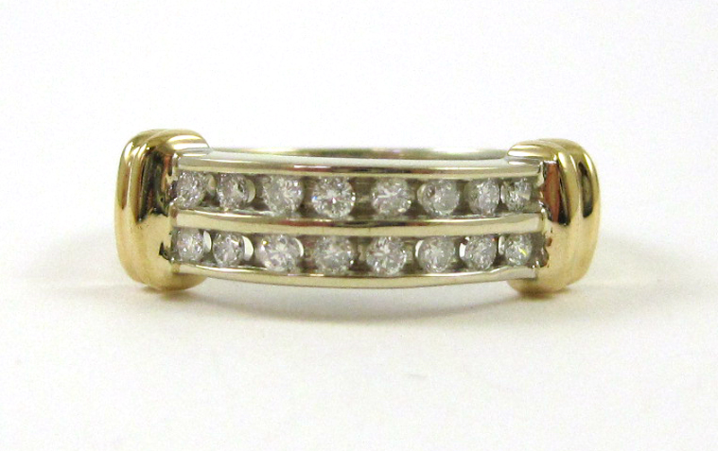 Appraisal: DIAMOND AND FOURTEEN KARAT GOLD RING The white and yellow