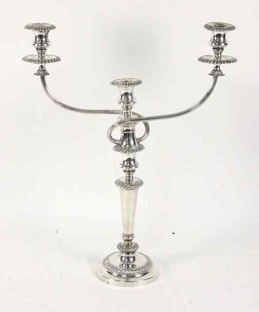 Appraisal: A Sheffield plated two-branch three-light candelabra on a column support