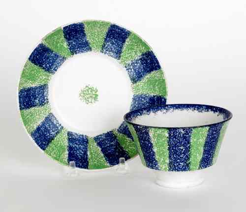 Appraisal: Blue and green rainbow spatter bull's-eye cup and saucer th