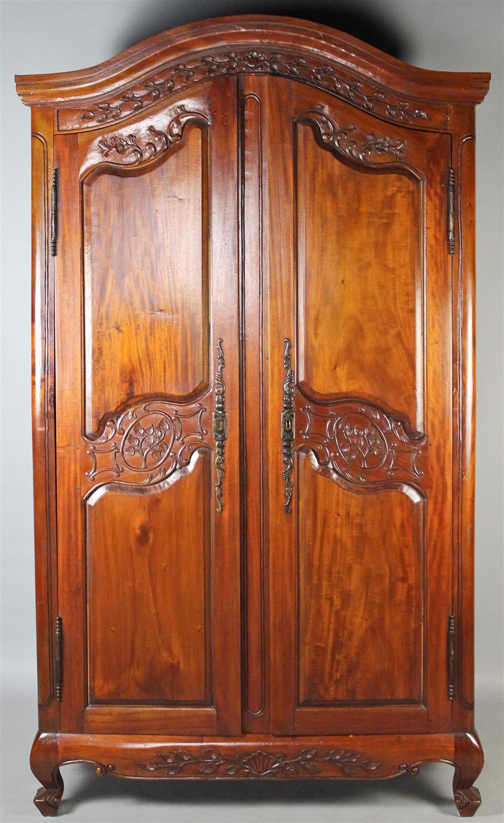 Appraisal: LOUIS XV STYLE MAHOGANY ARMOIRE arched cornice above leaf trellis